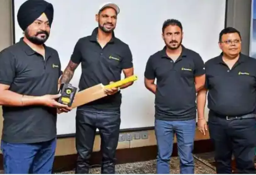 StanceBeam founder Arminder Thind with co-founder Ishwinderpal Singh, Dinesh Prasad adviser of the firm and Shikhar Dhawan holding the StanceBeam cricket bat sensor
