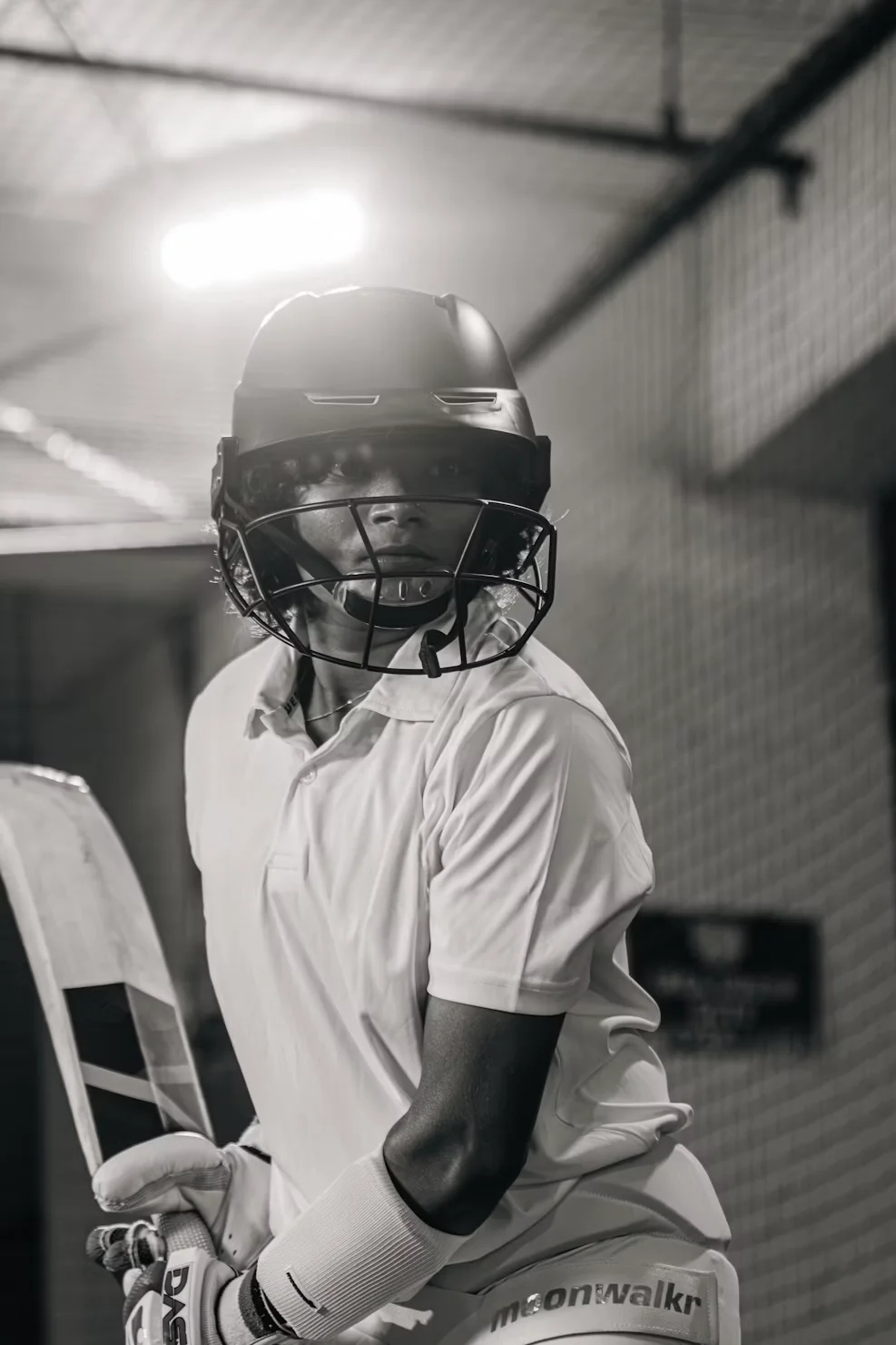 Young cricketer in helmet