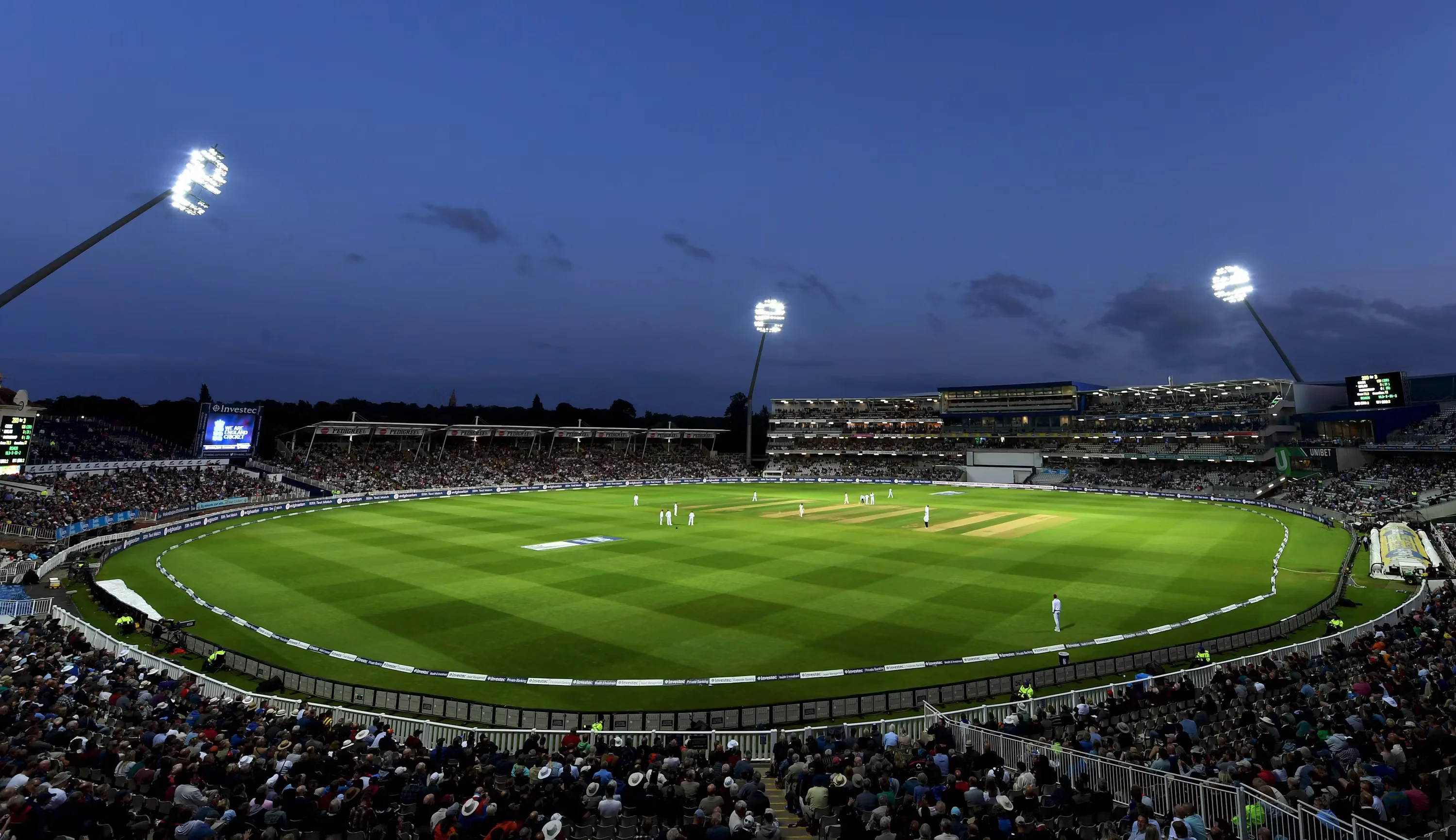 Stadium floodlights at dusk